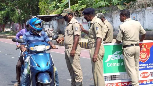 Police personnel stop vehicles l