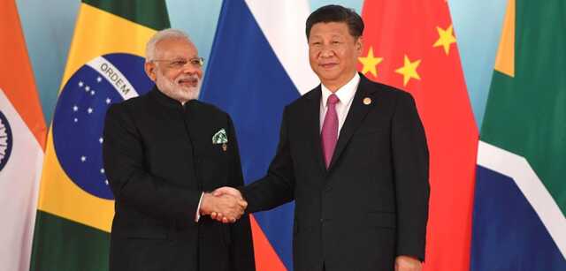 Prime minister of india narendra modi and president of china xi jinping before the beginning of the 2017 brics leaders meeting