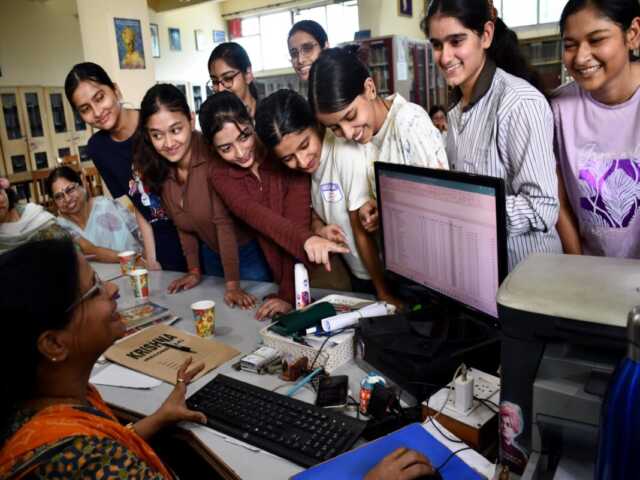 Students celebrate and cheer after the declaration of CBSE Class 12 board results